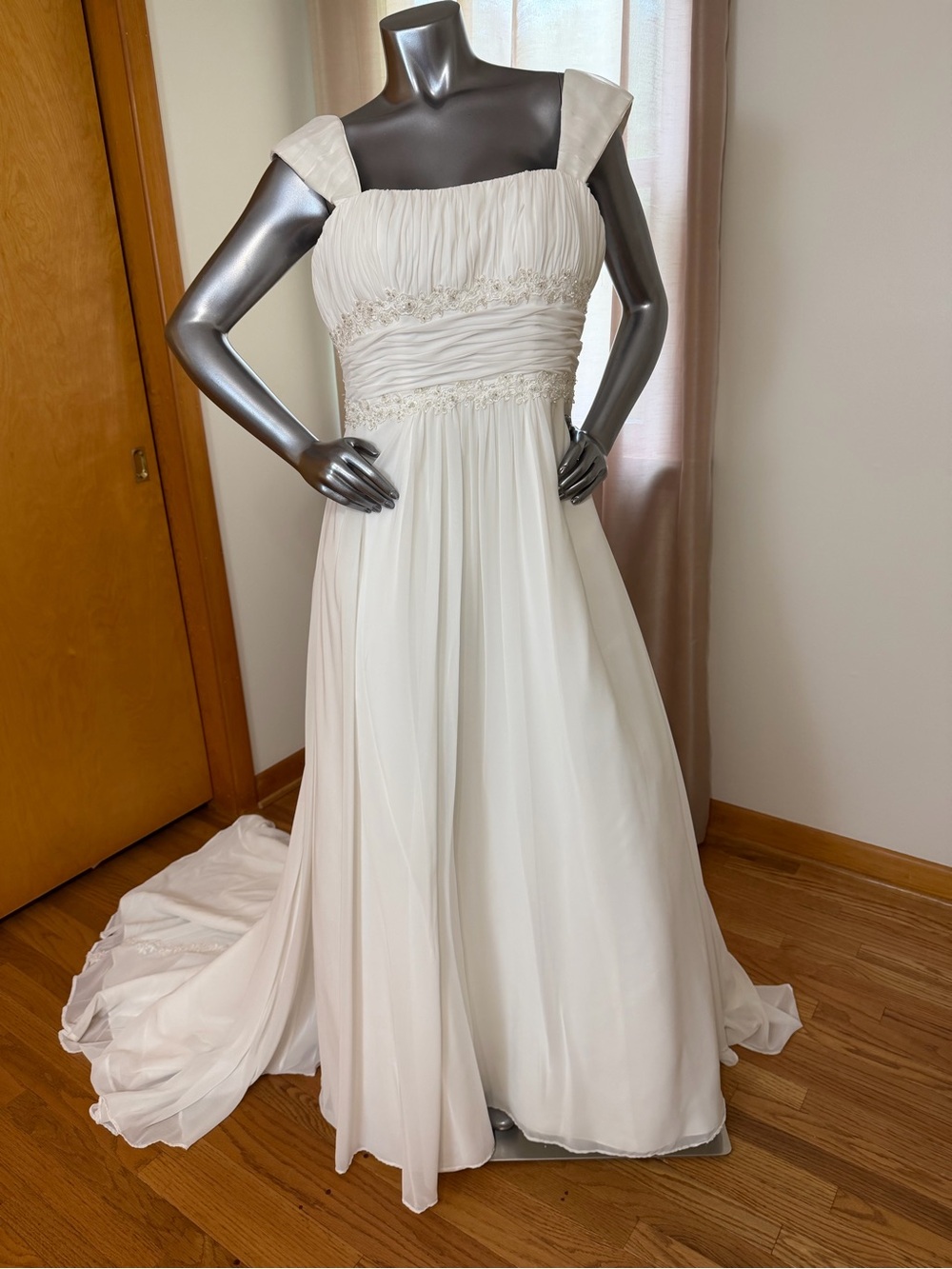 David’s Bridal style 9V9743 (V9743) is a classic strapless, empire-waist A-line